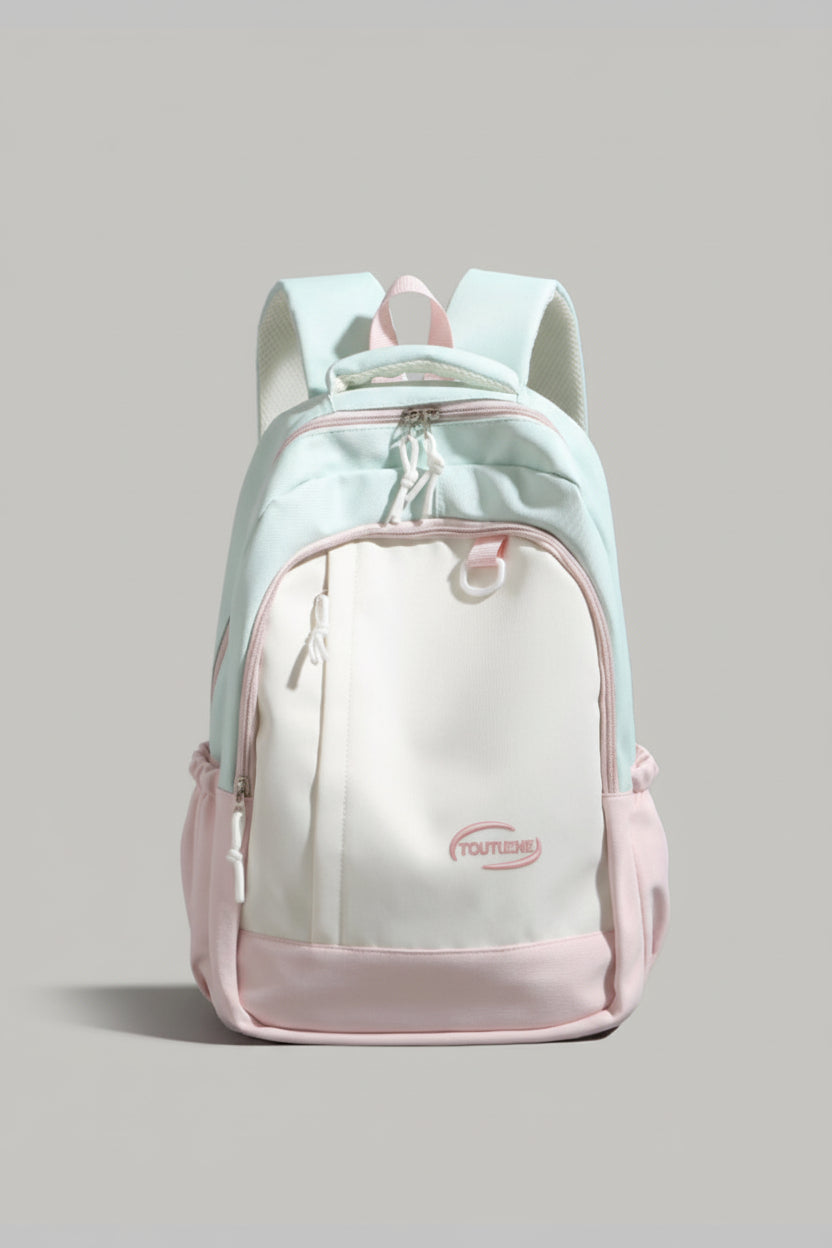 Light blue and pink backpack with a visible brand logo on a gray background
