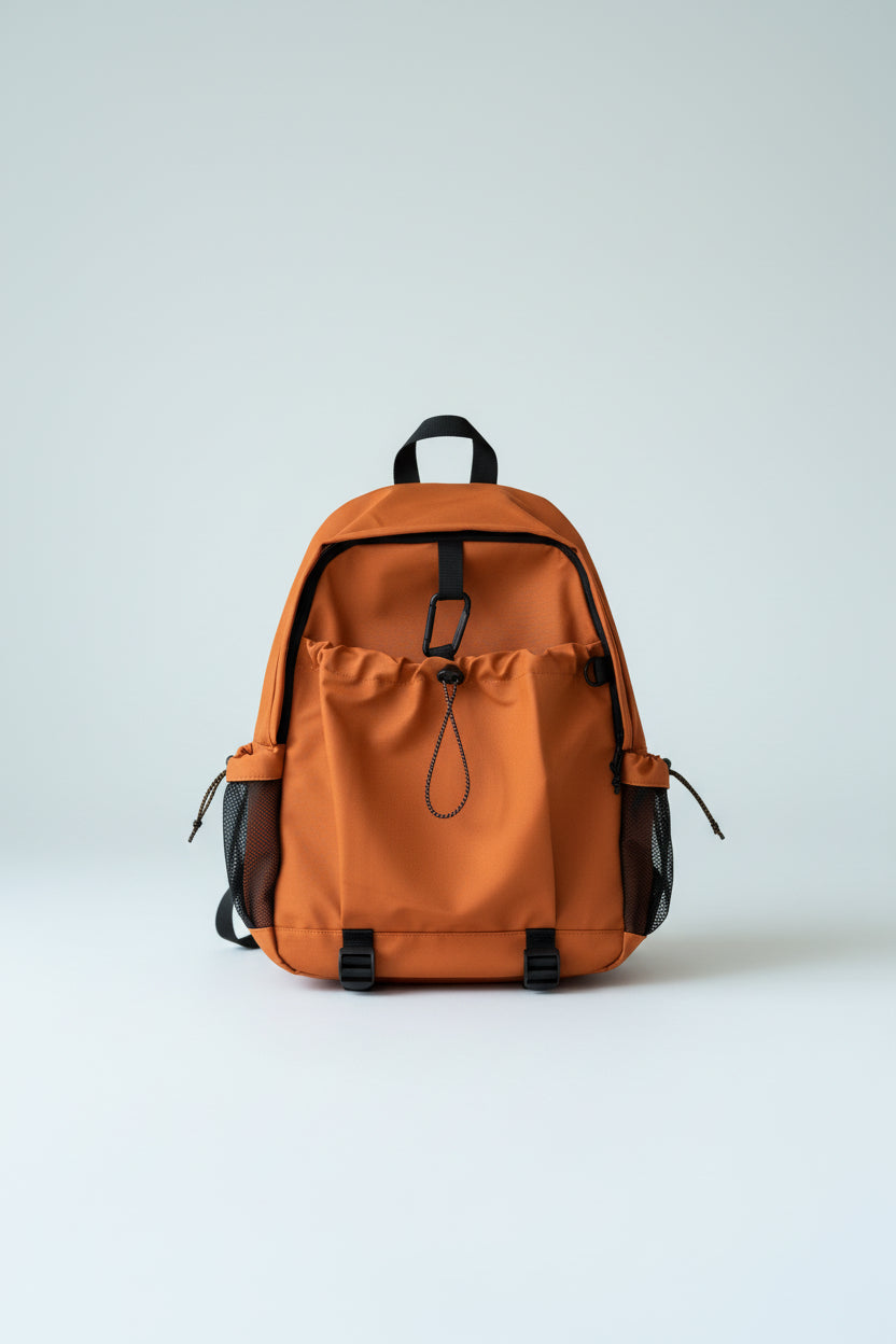 Orange backpack on a light gray background