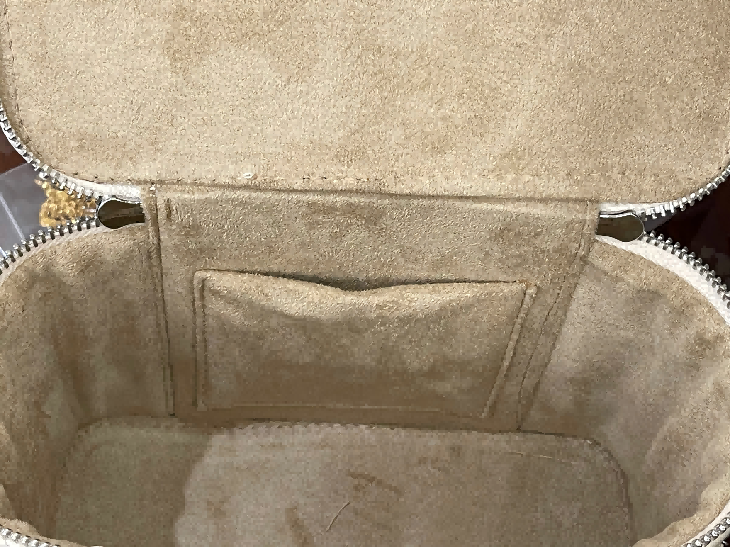 Close-up of beige leather saddle pad with stitching details
