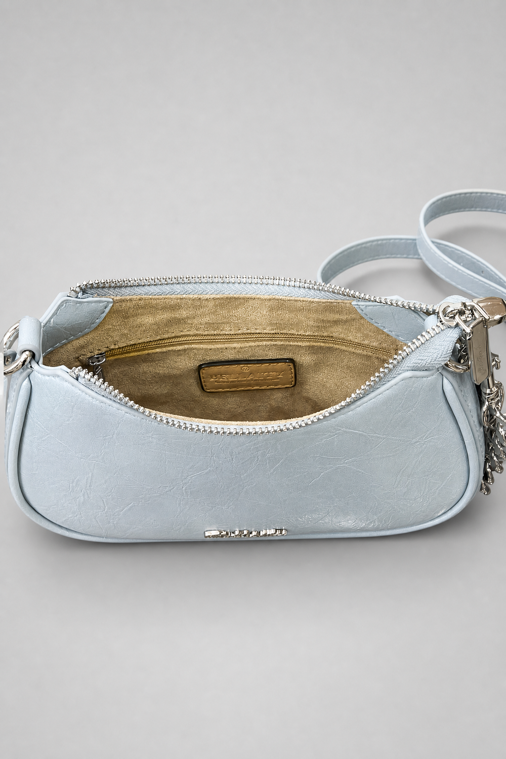Light blue handbag with a visible brand logo on a gray background
